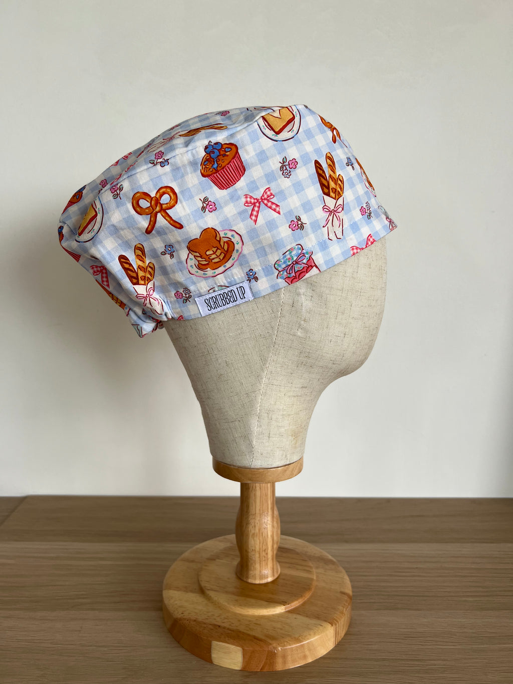 Breakfast print scrub cap side view on mannequin