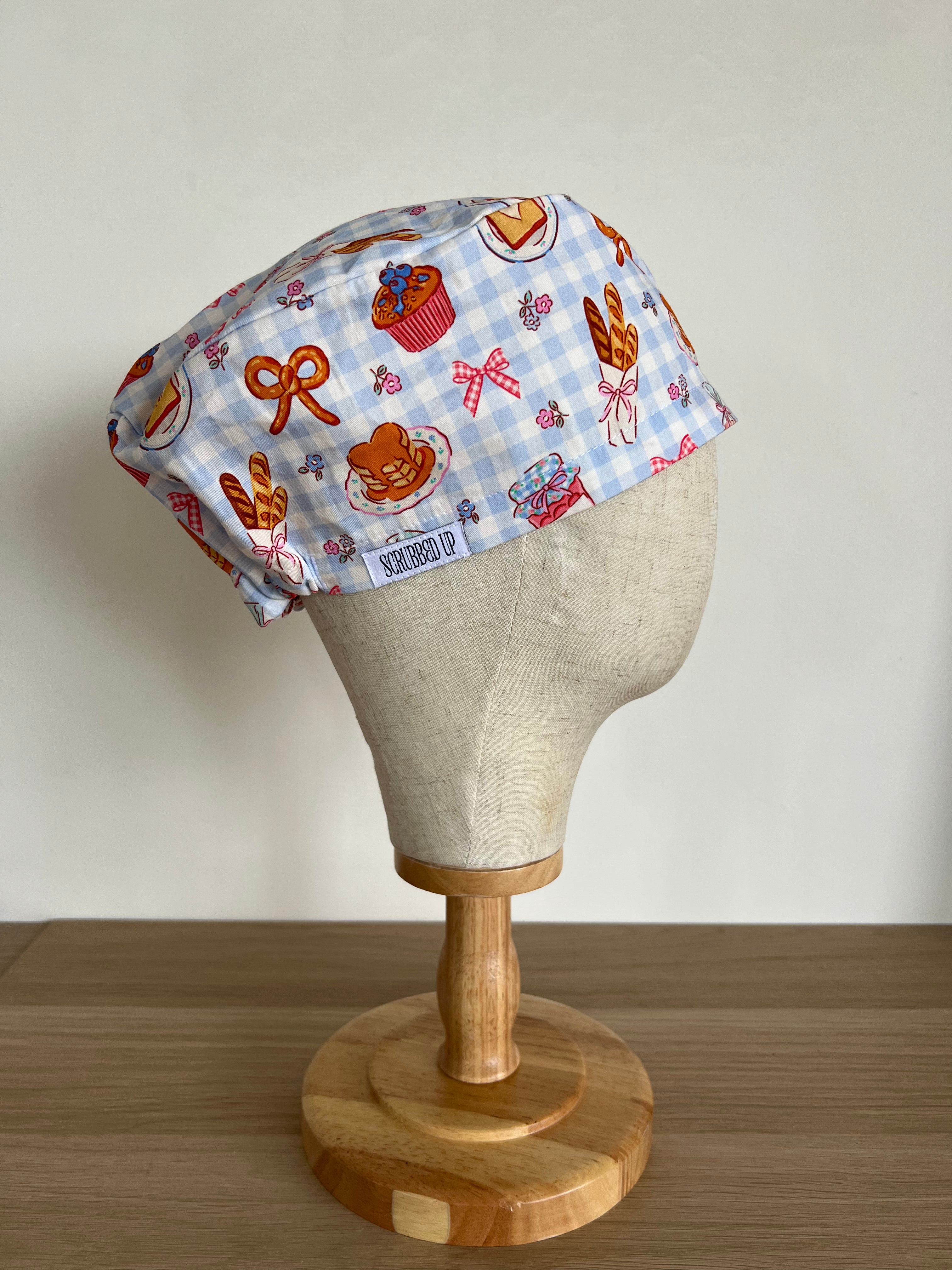Breakfast print scrub cap side view on mannequin