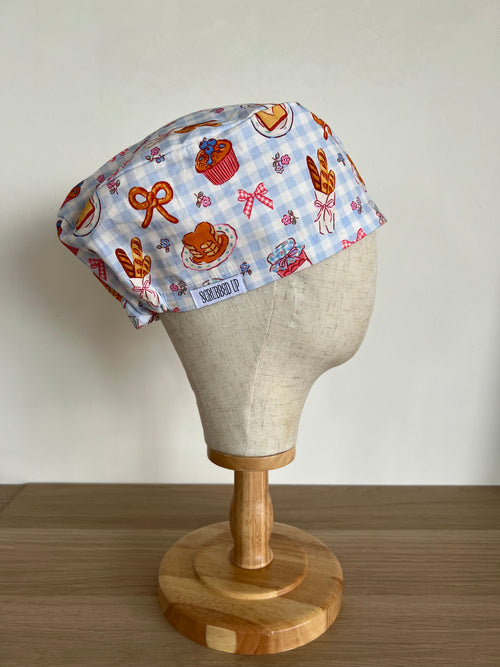 Breakfast print scrub cap side view on mannequin